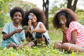 african-american-children-sitting-grass-looking-through-magnifying-glass-learn-beyond-classroom-education-outdoor-concept1