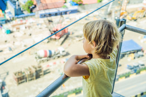 boy is looking construction site chooses his future profession