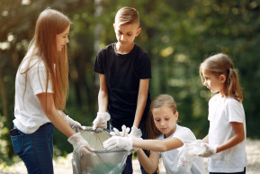 children collects garbage garbage bags park