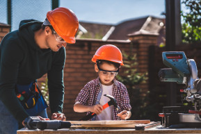 father-shows-his-little-son-how-use-hammer_0