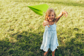 happy-pretty-little-girl-playing-with-paper-plane-summer-day-park-cute-kid-throwing-airplane-outdoors-garden-childhood-concept_0