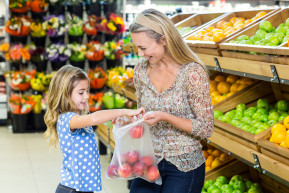 mother-daughter-picking-out-apple-supermarket